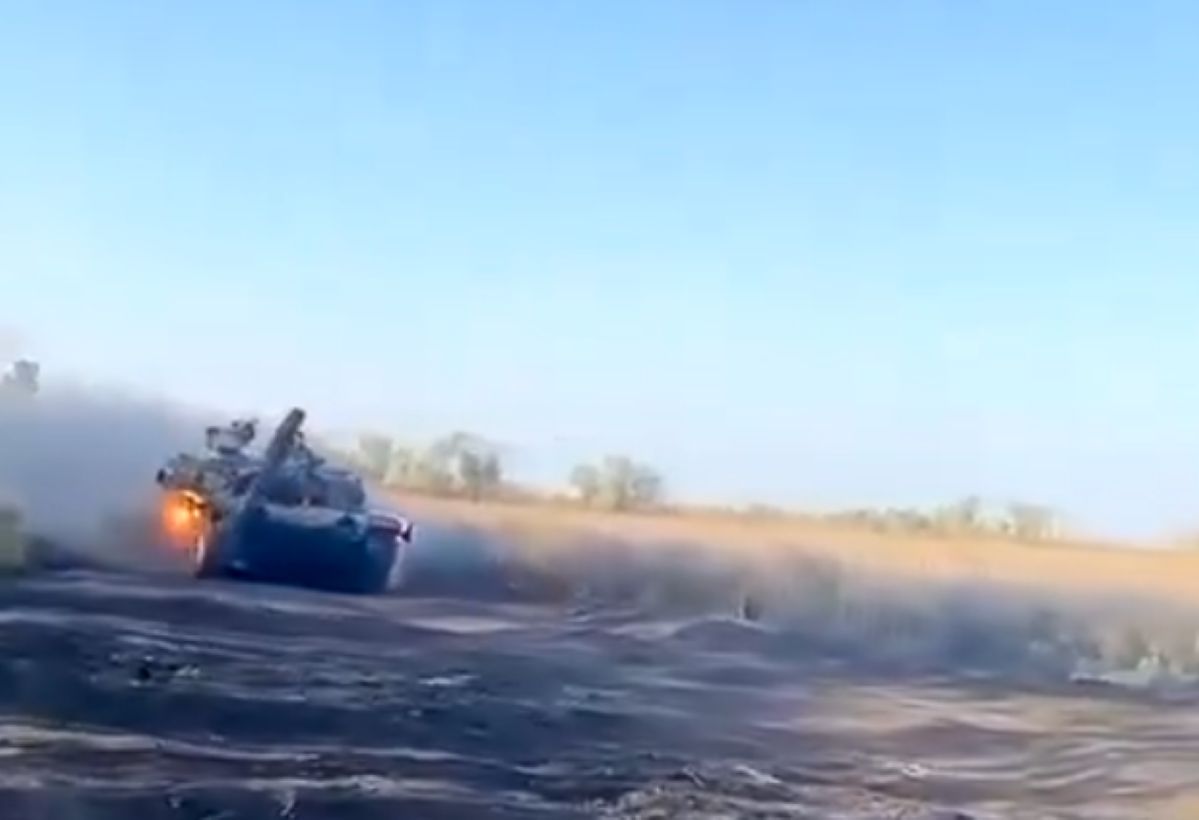 Spectacular action. Russian tank flees in flames