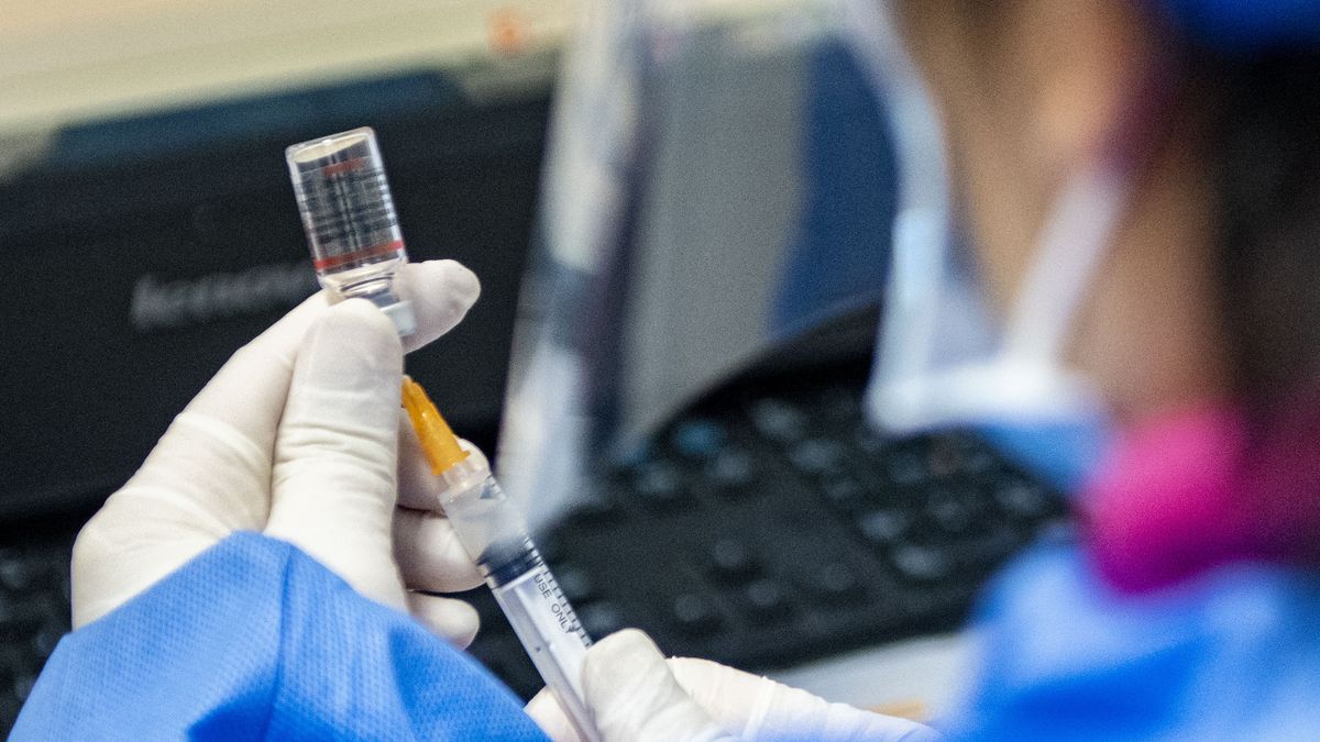 GUANGZHOU, CHINA - DECEMBER 06: A nurse prepares a does of COVID-19 vaccine at a community health service center on December 6, 2022 in Guangzhou, Guangdong Province of China. (Photo by VCG/VCG via Getty Images)