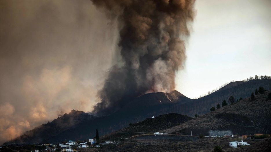 TemporaryThe Cumbre Vieja volcano is seen from Los Llanos de Aridane on the Canary island of La Palma in September 25, 2021. - La Palma airport, affected by the eruption of the Cumbre Vieja volcano, is inoperative due to the volcanic ash accumulation, AENA, the public body that manages Spanish airports, reported today. The Cumbre Vieja went on erupting on September 19, 2021 forcing the evacuation of more than 6,000 people and covering with lava more than 180 hectares (445 acres) of land. (Photo by DESIREE MARTIN / AFP)DESIREE MARTIN