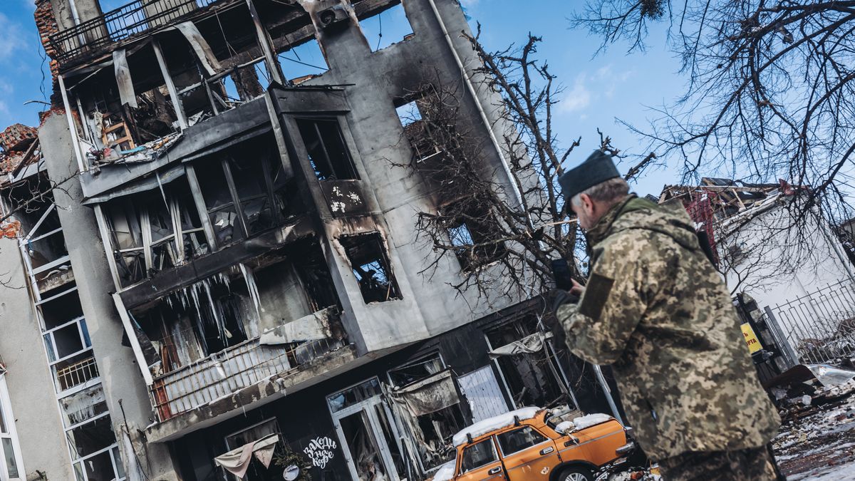 KHARKIV, UKRAINE - MARCH 13: A soldier in front of a destroyed building in Kharkov, Ukraine, on March 13, 2022 as Russian attacks continue. (Photo by Diego Herrera Carcedo/Anadolu Agency via Getty Images)