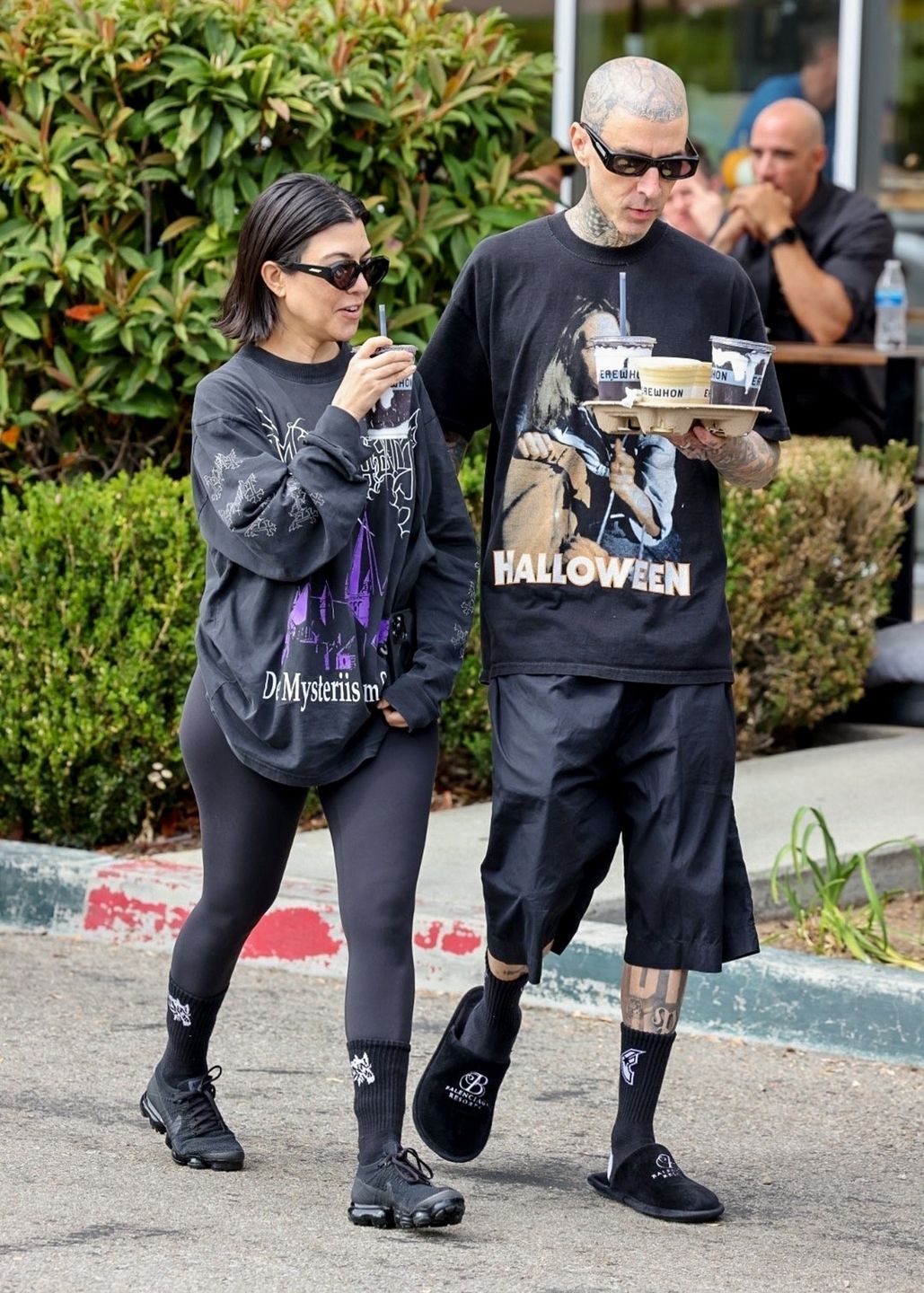 *EXCLUSIVE* Kourtney Kardashian and Travis Barker enjoy Poosh Potion Detox Smoothies by Kourtney Kardashian at ErewhonCalabasas, CALI  - *EXCLUSIVE* Kourtney Kardashian and her husband Travis Barker head to Erewhon market for Kourtney's new collaboration drink, Poosh Potion Detox Smoothie by Kourtney Kardashian, with Erewhon in Calabasas.*UK Clients - Pictures Containing ChildrenPlease Pixelate Face Prior To Publication*,Image: 731097570, License: Rights-managed, Restrictions: , Model Release: no, Pictured: Kourtney Kardashian, Travis Barker, Credit line: WCP,4cnrs / BACKGRID / Backgrid USA / ForumWCP,4cnrs / BACKGRID / Backgrid USA / ForumKourtney Kardashian, Travis Barker, Erewhon Market, Collaboration Drink, Poosh Potion Detox Smoothie by Kourtney Kardashian, Calabasas, Dark Attire, Halloween, Slippers, Shorts, Leggings, Weekend, Hollywood Couple, Celebrity Couples, Celebrity News, Celebrity Gossip, Celebrity Fashion, Celebrity Style, Celebrity Hair, Celebrity Sunglasses, Sunglasses, Style, Fashion