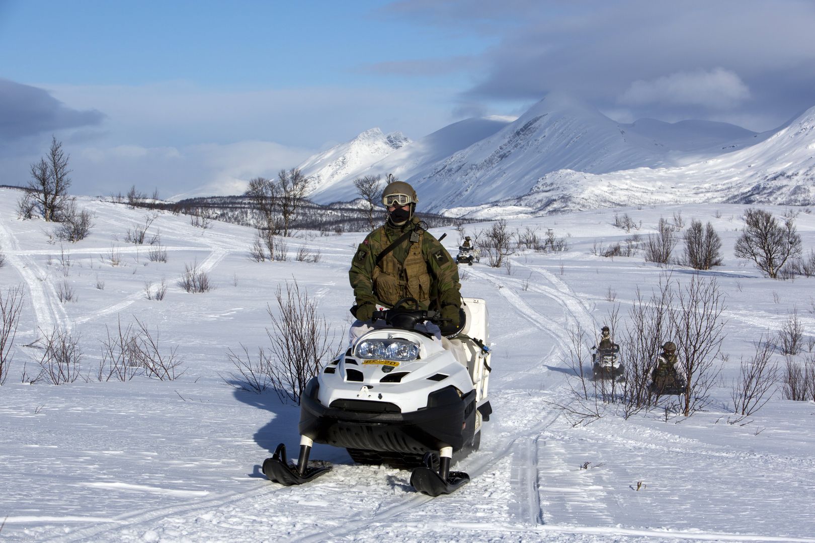 Norwegian Army Train In The Arctic Circle
SKJOLD, NORWAY - MARCH 6: Norwegian army soldiers use snowmobiles for mobility during a live fire exercise March 6, 2013  in Skjold, Norway. White camouflage uniforms do not completely help soldiers to blend into the snow. Their breath may give them away while holding a position in the snow. Ballistics and electronic devices function differently in extreme cold. (Photo by Robert Nickelsberg/Getty Images)
Robert Nickelsberg
Arctic Circle, Army, Aviation, Battle, Camoflage, Defence, Environment, Evacuation, Exercise, Extreme, Global Warming, Helicopter, Instruction, Invasion, Land, Landscape, Map, NATO, Norway, Preparedness, Scandinavia, Security, Simulation, Snow, Snowmobile, Soldier, Soldiers, Survival, Threat, Training, Transport, Transportation, Uniform, Water, Winter Warfare