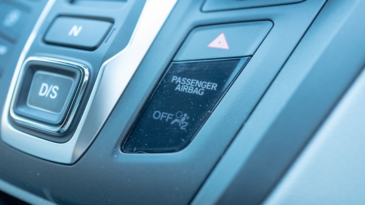 Close-up of passenger airbag indicator light on dashboard of a car in Lafayette, California, February 7, 2020. Many new vehicles automatically disable the passenger airbag if a passenger is below the weight requirement for safe airbag operation. (Photo by Smith Collection/Gado/Getty Images)