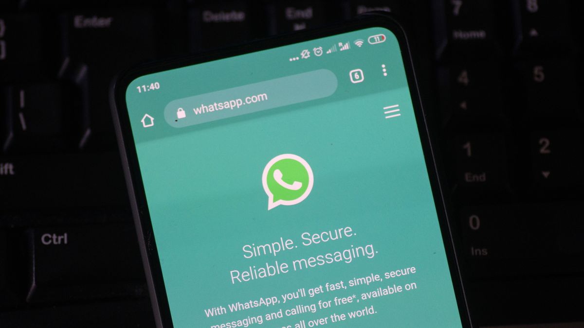 WhatsApp logo displayed on a phone screen, smartphone and keyboard are seen in this multiple exposure illustration. WhatsApp Messenger is a multiplatform mobile application that provides an encrypted instant messaging system belonging to Facebook, photo taken in Amsterdam, Netherlands on January 28, 2020 (Photo illustration by Nicolas Economou/NurPhoto via Getty Images)