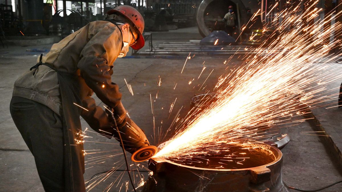 JINHUA, CHINA - FEBRUARY 26: A worker polishes steel at the polishing workshop of Zhejiang Wujing Machine Manufacture Co., Ltd. on February 26, 2024 in Jinhua, Zhejiang Province of China. (Photo by VCG/VCG via Getty Images)