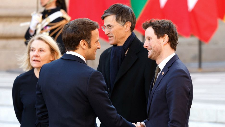 TemporaryFrance's President Emmanuel Macron greets France's Minister for European affairs Clement Beaune (R), next to Head of the Public Establishment of the Palace, Museum and National Estate of Versailles Catherine Pegard (L) and Versailles' mayor Francois de Mazieres (2nd R) at the Palace of Versailles, near Paris, on March 10, 2022, ahead of the EU leaders summit to discuss the fallout of Russia's invasion in Ukraine. - EU leaders are scrambling to find ways to urgently address the fallout of Russia's invasion of Ukraine that has imperilled the bloc's economy and exposed a dire need for a stronger defence. (Photo by Ludovic MARIN / AFP)LUDOVIC MARIN