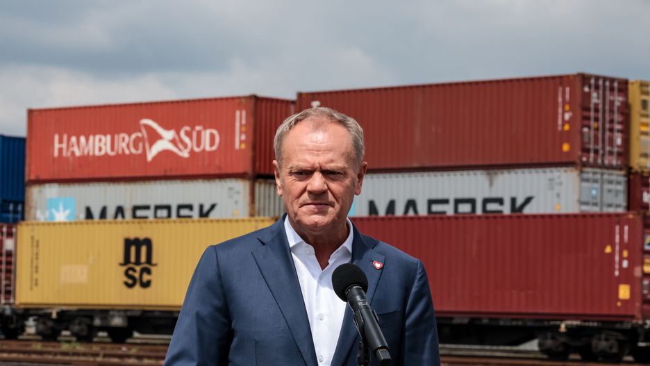 Prime Minister of Poland, Donald Tuskspeaks to press in Euroterminal Slawkow that provides train transport with Ukraine and Asia in Slawkow, Silesian voivodeship, Poland on May 26, 2025. Train transport with the East of Europe, including Ukraine and with Asia pose difficulties as Eastern countries have different width of train tracks. Euroterminal Slawkow is one of a few logistic hubs that can provide load transport onto Eastern size tracks. Poland aims to invest in the hub. (Photo by Dominika Zarzycka/NurPhoto via Getty Images)