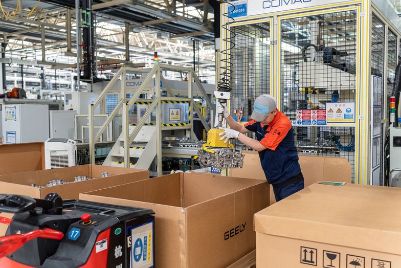 YIWU, CHINA - JUNE 17: A technician puts components of M252 engine into a box at the workshop of Zhejiang Yili Automobile Components Co., Ltd. on June 17, 2025 in Yiwu, Zhejiang Province of China. The M252 engine, which was jointly developed by Geely Automobile and Mercedes-Benz, will be exported to Germany. (Photo by VCG/VCG via Getty Images)