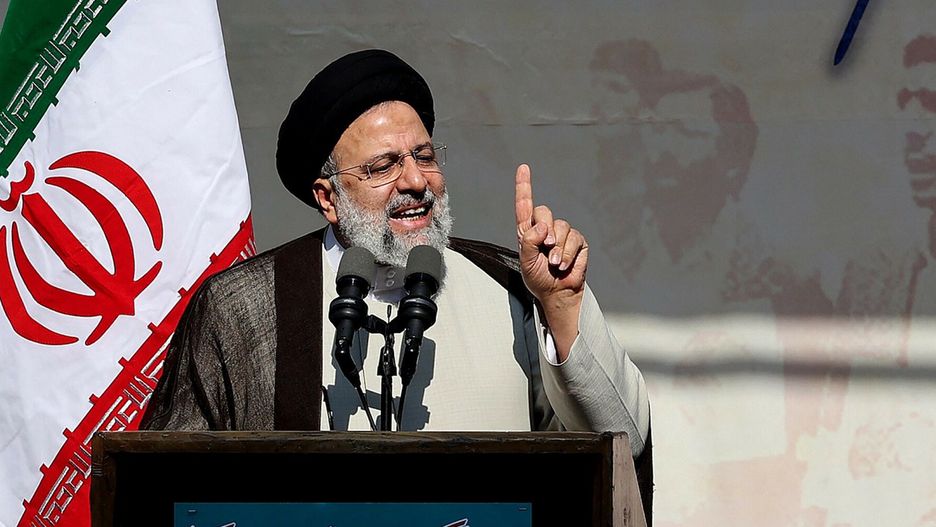 arch52
Iran's President Ebrahim Raisi gestures as he speaks during a rally outside the former US embassy in the capital Tehran on November 4, 2022, to mark the 43th anniversary of the start of the Iran hostage crisis. - More than 50 US embassy staff were taken hostage in the seizure of its mission by supporters of the Islamic revolution on November 4, 1979. (Photo by ATTA KENARE / AFP)
ATTA KENARE