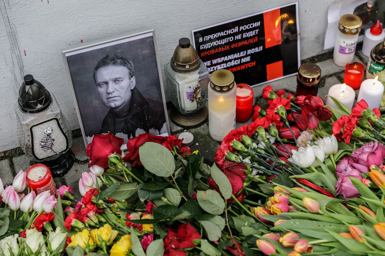 WARSAW, POLAND - 2024/02/24: Flowers, candles, and a portrait of Alexei Navalny, who died in prison, are placed near the walls of the Russian Embassy in Warsaw during the rally dedicated to the second anniversary of the full-scale invasion of Russia into Ukraine. Poland is a country that, in the first days of the full-scale invasion of Russia into Ukraine on February 24, 2022, accepted the largest number of refugees from Ukraine. On the second anniversary of the full-scale invasion, several thousands of people participated in the rally near the Embassy of the Russian Federation in Warsaw. (Photo by Volha Shukaila/SOPA Images/LightRocket via Getty Images)