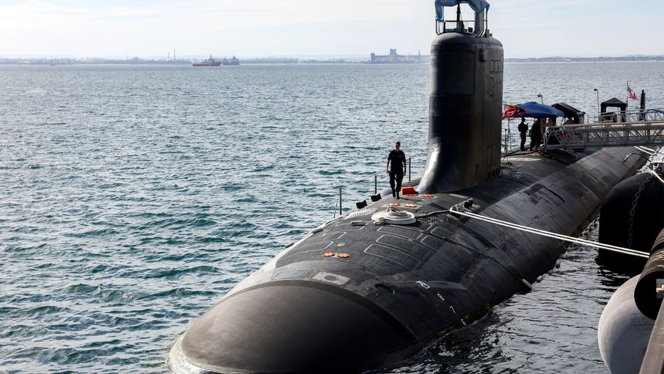 ROCKINGHAM, AUSTRALIA - FEBRUARY 26: U.S. Navy officers stand guard aboard Virginia-class fast attack submarine USS Minnesota (SSN-783) after the vessel docked at HMAS Stirling on February 26, 2025 in Rockingham, Australia. The submarine was on a port visit. (Photo by Colin Murty - Pool/Getty Images)