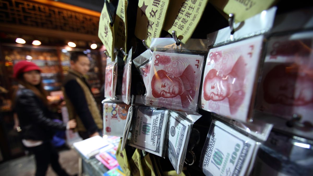 General Views Of Beijing As Asia Pacific Economic Cooperation (APEC) Meetings Commence
A couple walk past wallets with images of Chinese yuan banknotes and U.S. dollar banknotes displayed at a store in Beijing, China, on Friday, Nov. 7, 2014. Heads of state including U.S. President Barack Obama and his Russian counterpart Vladimir Putin are scheduled to attend the Asia Pacific Economic Cooperation (APEC) leadership summit in Beijing on Nov. 10-11. Photographer: Tomohiro Ohsumi/Bloomberg via Getty Images
Bloomberg
ASIA; EAST ASIA; CHINA, ASIAN; CHINESE, ECONOMY; ECONOMIC; ECO, HORIZONTAL, RETAIL; RETAILER; STORE; STORES, SHOPPER; SHOPPERS; RETAIL, SHOP; SHOPS; SHOPPING