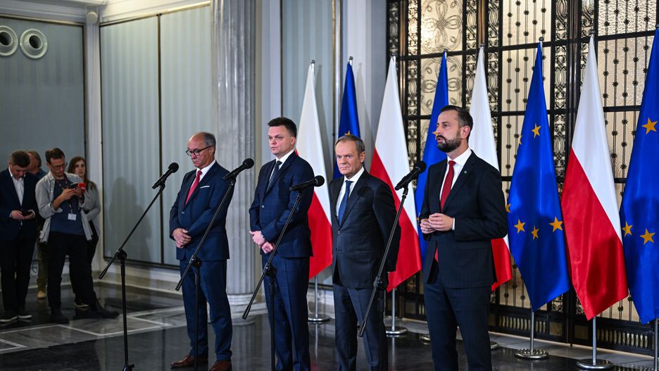 WARSAW, POLAND - OCTOBER 24: One of the leaders of the New Left, Wlodzimierz Czarzasty (L), the leader of Poland 2050 Party, Szymon Holownia (2nd L) , the leader of Civic Coalition (KO), Donald Tusk (2nd R), and the Leader of Polish People's Party (PSL), Wladyslaw Kosiniak Kamysz (R) stand together as they give a press statement in Warsaw, Poland on October 24, 2023. On Tuesday and Wednesday, Oct . 24 and 25 President Andrzej Duda will hold individual consultations with leaders of political parties that have won seats in the parliament of the new term. With the results of the Parliamentary elections out, Poland's democratic opposition made of the Civic Coalition, The Third Way Political alliance, and The New Left has the chance to rule with a majority and all have refused to enter a coalition with the ruling government party, Law and Justice. (Photo by Omar Marques/Anadolu via Getty Images)