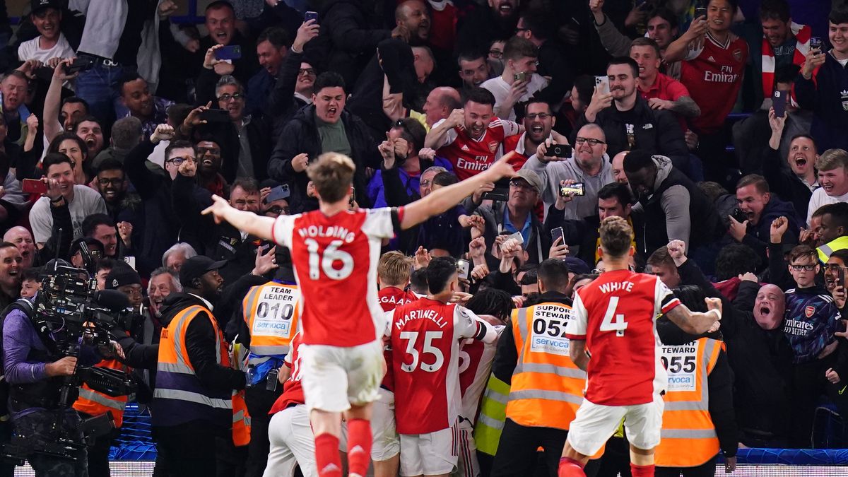 Arsenal's Bukayo Saka celebrates scoring his sides fourth goal with the away fans during the Premier League match at Stamford Bridge, London. Picture date: Wednesday April 20, 2022. (Photo by Adam Davy/PA Images via Getty Images)