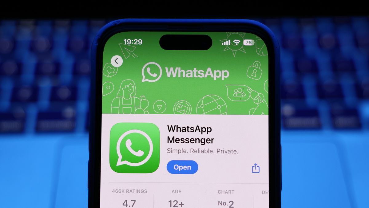 A laptop keyboard and WhatsApp on App Store displayed on a phone screen are seen in this illustration photo taken in Krakow, Poland on March 17, 2025. (Photo by Jakub Porzycki/NurPhoto via Getty Images)