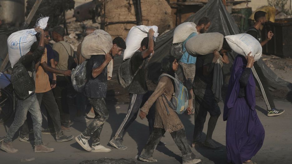 Temporary
Palestinians carry sacks of flour unloaded from a humanitarian aid convoy that reached Gaza City from the northern Gaza Strip, Saturday, July 26, 2025. (AP Photo/Jehad Alshrafi)
Jehad Alshrafi