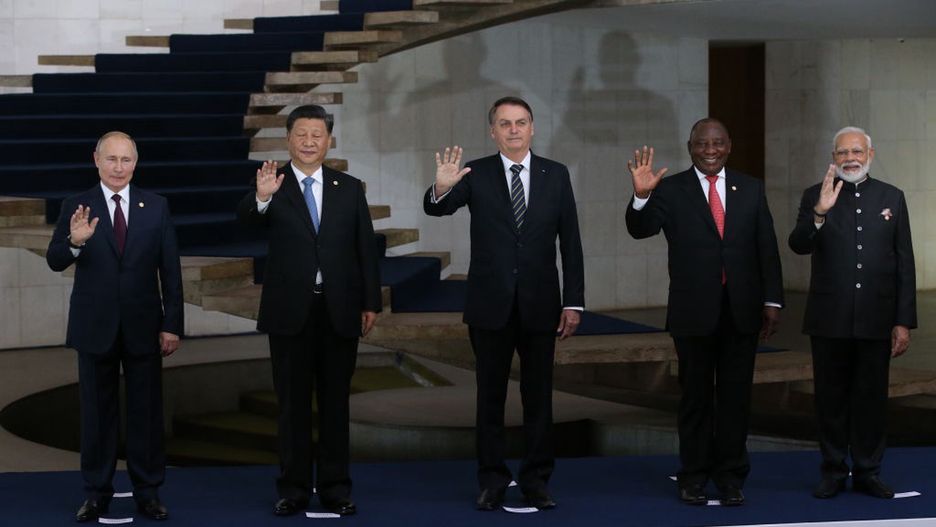 Russian President Vladimir Putin and Chinese President Xi Jinping attend the BRICS Summit in BrasiliaBRASILIA, BRAZIL - NOVEMBER 14 (RUSSIA OUT) Russian President Vladimir Putin (L), Chinese President Xi Jinping (2L), Brazilian President Jair Bolsonaro (C), South African President Matamela Cyril Ramaphosa (2R) and Indian Prime Minister Narendra Modi (R) wave during a welcoming ceremony on November 14, 2019 in Brasilia, Brazil. Leaders of Russia, China, Brazil, India and South Africa have gathered in Brasila for the BRICS Leaders Summit. (Photo by Mikhail Svetlov/Getty Images)Mikhail Svetlov