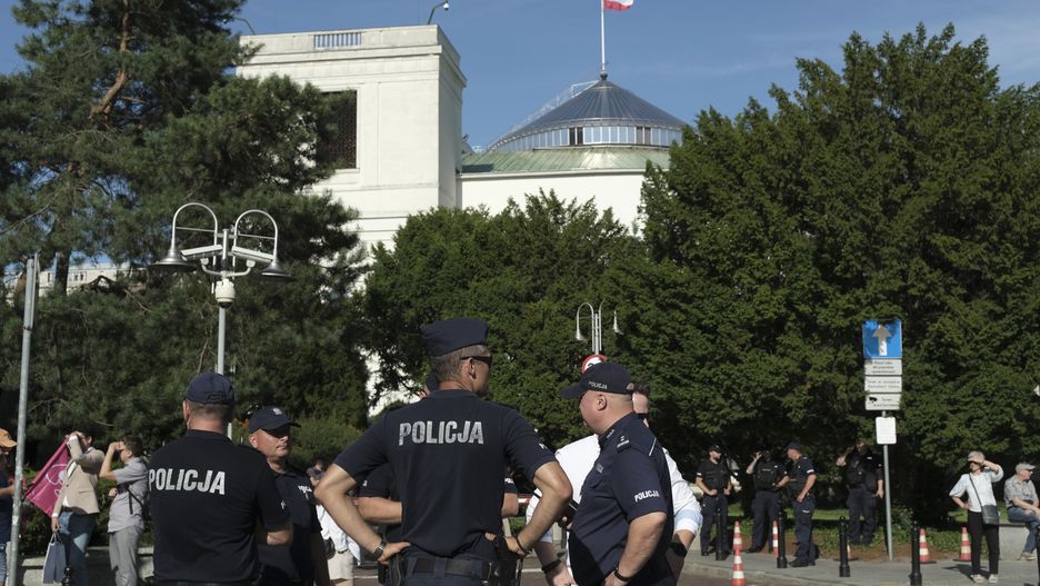 Police officers stand outside the Polish parliament, also known as the Sejm, during a pro-abortion demonstration, by the All-Poland Women's Strike, in Warsaw, Poland, on Tuesday, July 23, 2024. Polish Prime Minister Donald Tusk's government failed to pass legislation to decriminalize abortion in a tight vote, laying bare divisions within the ruling coalition on an issue that's polarized the nation. Photographer: Damian Lemanski/Bloomberg via Getty Images