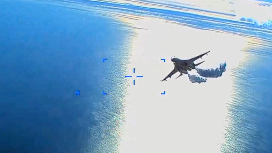 SEVASTOPOL, UKRAINE - MARCH 14: In this screengrab of a video clip released by the United States Defense Department's European Command, a Russian Su-27 fighter jet flies near an American MQ-9 Reaper drone, spraying what the US government says is jet fuel, on March 14, 2023 over the Black Sea near Crimea. On a final pass, the Russian jet allegedly collided with the drone, damaging its propeller, forcing it to be brought down in the Black Sea. (Photo by US Defense Department European Command via Getty Images)