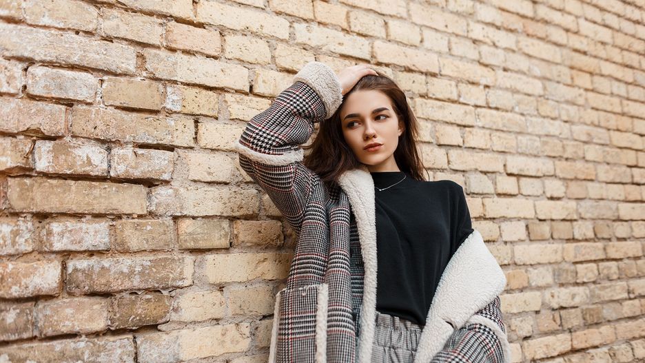 Beautiful young brunette woman in vintage gray pants in a black shirt in a fashionable plaid jacket posing standing near a brick building. Stylish girl model outdoors. Retro style.Alesadult, attractive, beauty, beige, black, brick, brunette, building, caucasian, cell, checkered, clothes, coat, cute, elegant, european, fashion, fashionable, female, fur, girl, gray, hair, house, jacket, lady, lifestyle, model, modern, natural, old, outdoor, outdoors, outerwear, pants, pattern, pretty, sexy, spring, style, stylish, sweater, trendy, trousers, vintage, wall, white, woman, young, youth