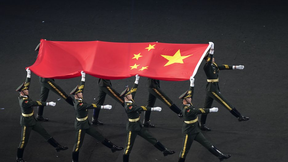 BEIJING, CHINA - FEBRUARY 04: A Chinese national flag is carried during the Opening Ceremony of the Beijing 2022 Winter Olympics at the Beijing National Stadium on February 4, 2022 in Beijing, China. (Photo by Cui Nan/China News Service via Getty Images)