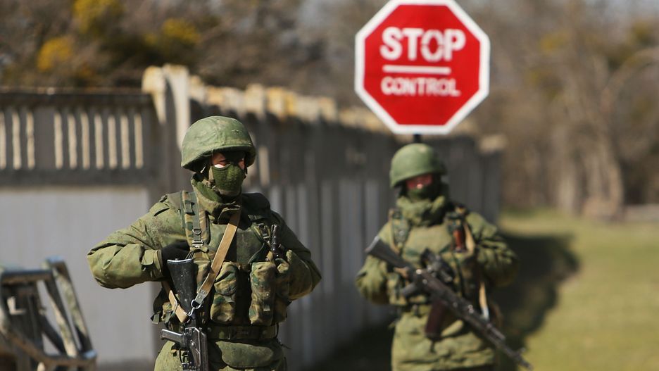 Crimean Parliament Seeks Formal Union With Russia
PEREVEVALNE, UKRAINE - MARCH 17:  Armed soldiers without identifying insignia keep guard outside of a Ukrainian military base in the town of Perevevalne near the Crimean city of Simferopol on March 17, 2014 in Perevevalne, Ukraine. Voters on the autonomous Ukrainian peninsular of Crimea voted overwhelmingly yesterday to secede from their country and join Russia.  (Photo by Spencer Platt/Getty Images)
Spencer Platt
Diplomacy, Government, Politics, Russian, bestof, bestof, putin, russia, topics, topics, topix, topix, toppics, toppics, toppix, toppix, war