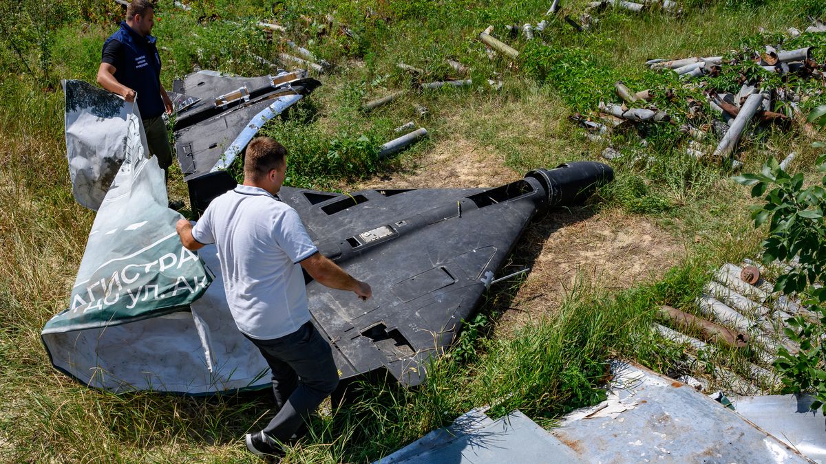 KHARKIV, UKRAINE - JULY 30: Officers of the Kharkiv regional prosecutor's office cover the carbon fiber remains of a Russian-made, Iran-designed Shahed-136 drone, known as a Geran-2 in Russia, as the prosecutor's office maintains a collection of Russian drones, glide bombs, missiles and rockets launched at Ukraine as evidence for eventual war crimes prosecutions against Russia, on July 30, 2025 in Kharkiv, Ukraine. Russia has intensified missile and drone attacks against Ukraine, firing more than 700 in a single night, often against civilian targets, amidst a surge of daily aerial bombardments of urban centers, 3 1/2 years after Russia's all-out invasion of Ukraine. (Photo by Scott Peterson/Getty Images)
