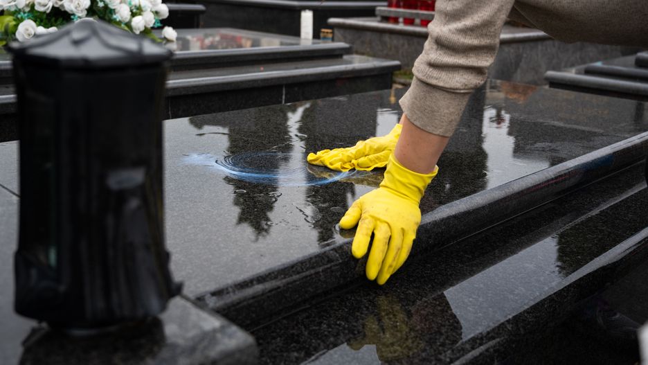 Headstone cleaning, polishing treatment
Headstone cleaning on cemetery. Professional in yellow gloves cleans the marble grave, polishing marble tombstone with special liquid,  preparation for All Saints Day on November 1st
Robert Petrovic
headstone, cleaning, grave, cemetery, hand, polishing, detergent, care, maintenance, wipe, cloth, marble, water, gloves, tombstone, All Saints Day, treatment, washing, flower, soap, chemical, preparation, gravestone, black, yellow, religion, rubber, catholic, November 1st, Saints, day, low angle view, graveyard, unrecognizable person, backgrounds, one person, Caucasian
