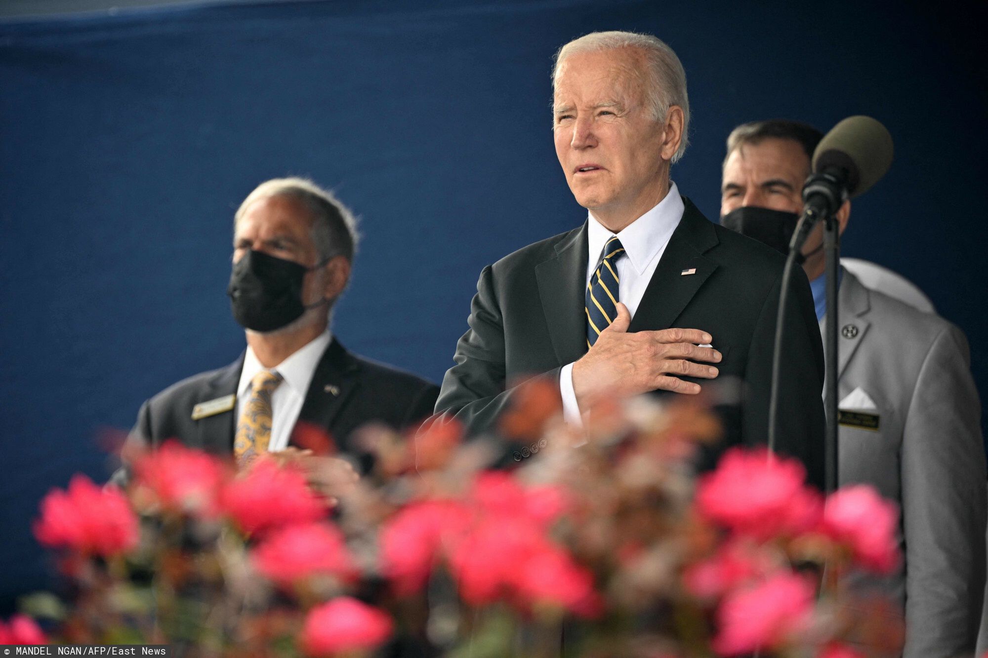 TemporaryUS President Joe Biden listens to the national anthem before addressing the US Naval Academy?s Class of 2022 graduation and commissioning ceremony at Navy-Marine Corps Memorial Stadium in Annapolis, Maryland, on May 27, 2022. (Photo by MANDEL NGAN / AFP)MANDEL NGAN