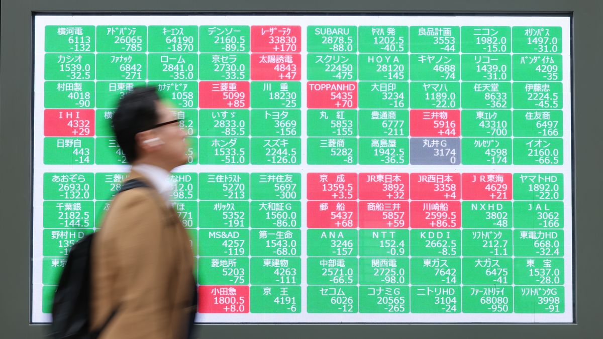 Share prices displayed outside a securities firm in Tokyo, Japan, on Monday, March 2, 2026. Stocks fell and crude oil surged as an escalation in the Middle East conflict unsettled global markets, prompting investors to trim risk exposure and seek haven assets. Photographer: Kiyoshi Ota/Bloomberg via Getty Images
