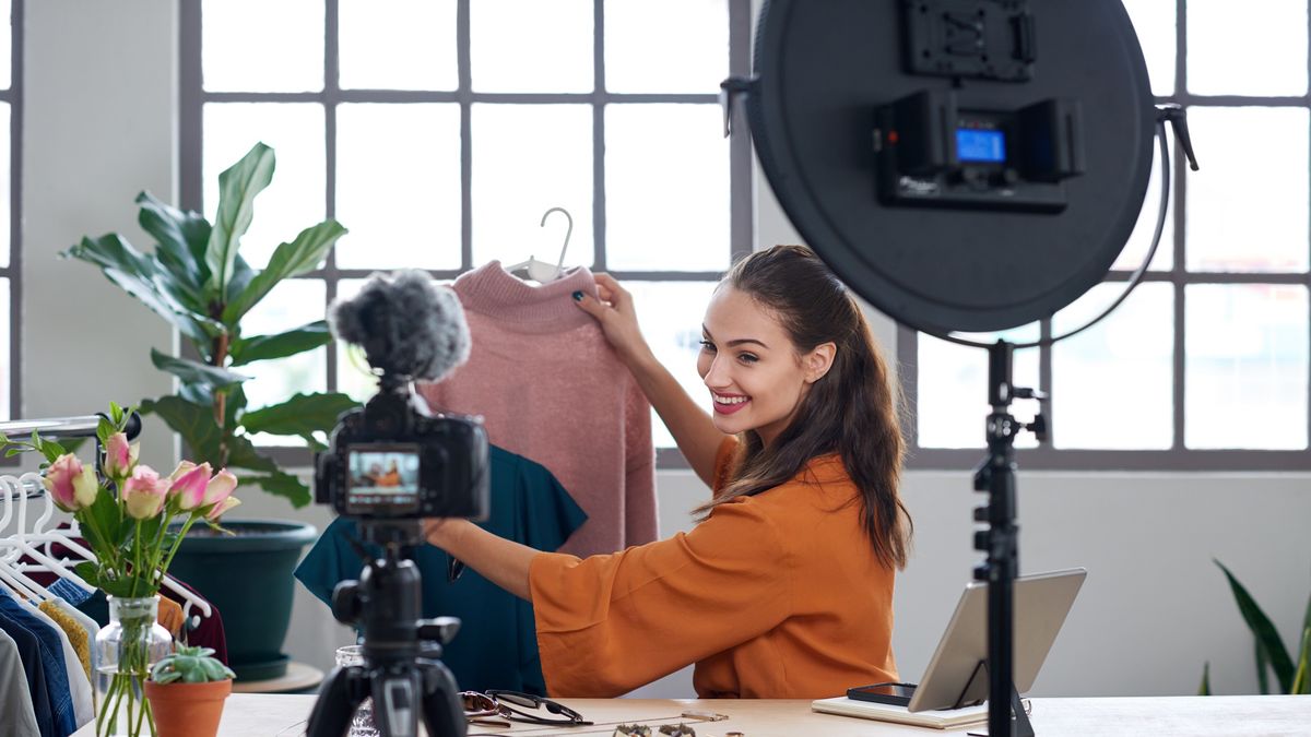 Fashion influencer vlogger creating videos for her channelYoung female vlogger recording content for her online fashion channel on social media, giving fashion adviceadvice, beautiful, beauty, blog, blogger, camera, channel, content, creator, entrepreneur, equipment, fashion, freelance, influencer, information, internet, job, lifestyle, methods, modern, occupation, online, podcast, pretty, promoter, recording, showing, subscribers, technology, tripod, video, video diary, videoblog, vlog, vlogger, woman, young, influencer, fashion, creator, blog, blogger, advice, beautiful, beauty, camera, channel, content, entrepreneur, equipment, freelance, information, internet, job, lifestyle, methods, modern, occupation, online, podcast, pretty, promoter, recording, showing, subscribers, technology, tripod, video, video diary, videoblog, vlog, vlogger, woman, young