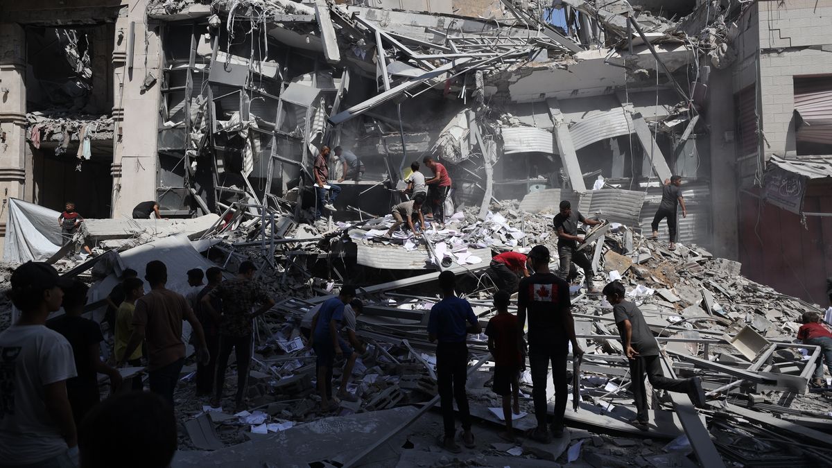 GAZA CITY, GAZA - SEPTEMBER 24: Palestinians inspect the destruction after Israeli airstrike hit Bank of Palestine in Gaza Strip on September 24, 2025. The building of Bank of Palestine completely destroyed while other nearby buildings damaged in the attack. (Photo by Khames Alrefi/Anadolu via Getty Images)
