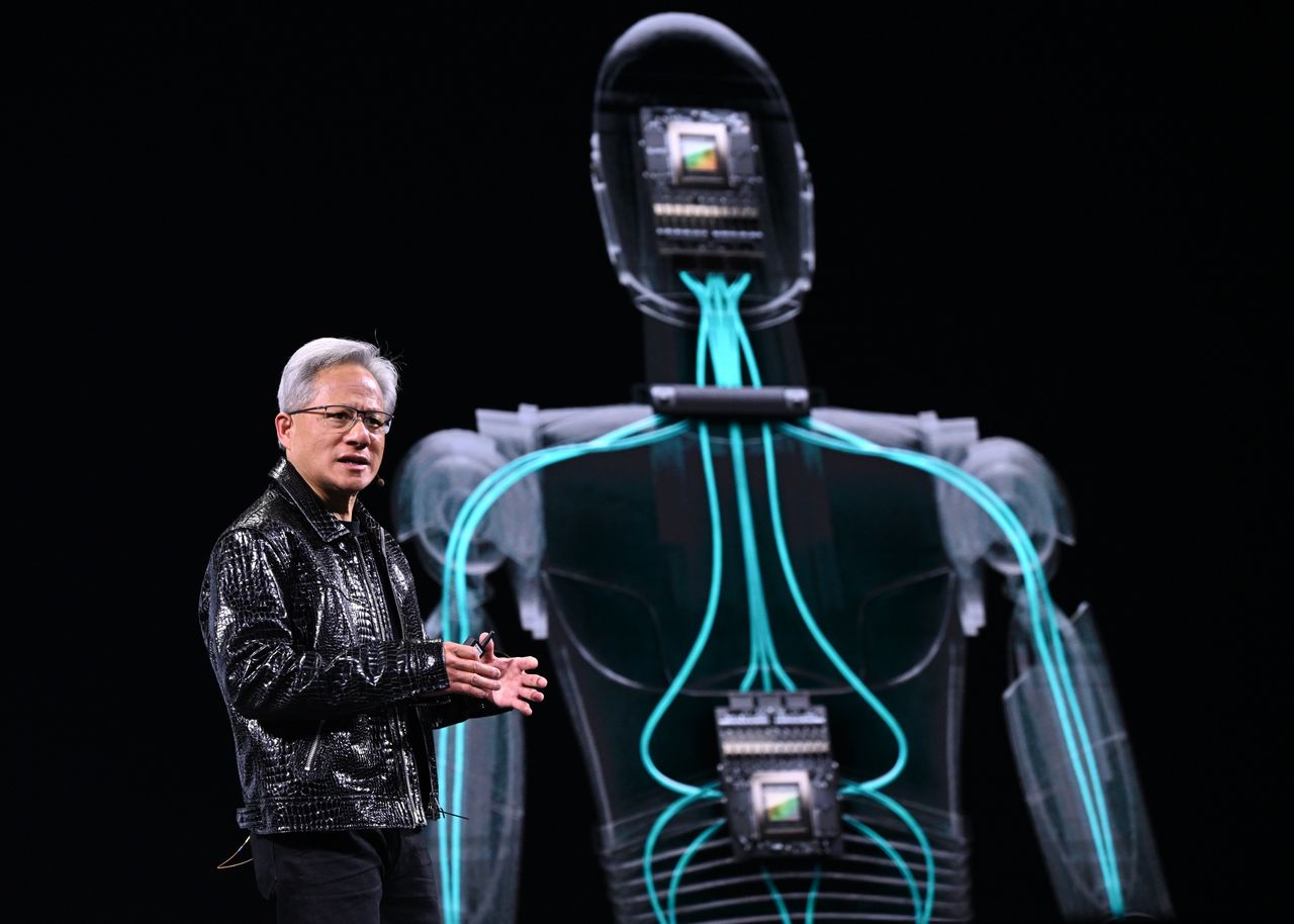 LAS VEGAS, USA - JANUARY 06: Nvidia CEO Jensen Huang delivers a keynote address at the Consumer Electronics Show (CES) 2025, showcasing the company's latest innovations in Las Vegas, Nevada, USA, on January 6, 2025. At the event, Huang unveiled advanced AI for training robots and cars, enhanced gaming chips, and Nvidia's first desktop computer, while also detailing how the company was expanding its data center AI technology to consumer PCs and laptops. (Photo by Artur Widak/Anadolu via Getty Images)