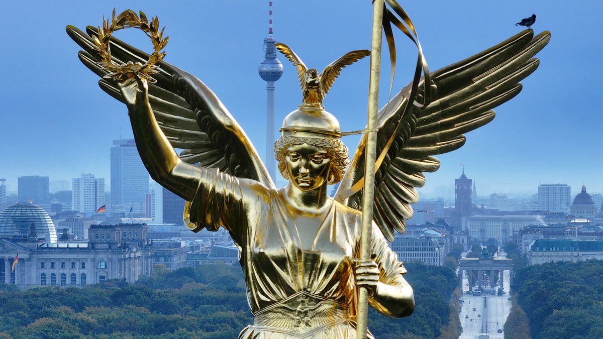 Aerial Views Of Angel Victoria On Berlin's Victory Column Landmark
BERLIN, GERMANY - OCTOBER 22: In this aerial view the golden Angel Victoria stands on the Victory Column in Tiergarten park as city landmarks, including the Reichstag, the broadcast tower at Alexanderplatz, City Hall and the Brandenburg Gate stand behind on October 22, 2023 in Berlin, Germany. The Victory Column was originally finished in 1873 as a monument to the mid-19th century wars, including the German-Danish War (1864), the German-Austrian War (1866) and the German French War (1870-1871), that led to the creation of the first German Empire.  (Photo by Sean Gallup/Getty Images)
Sean Gallup