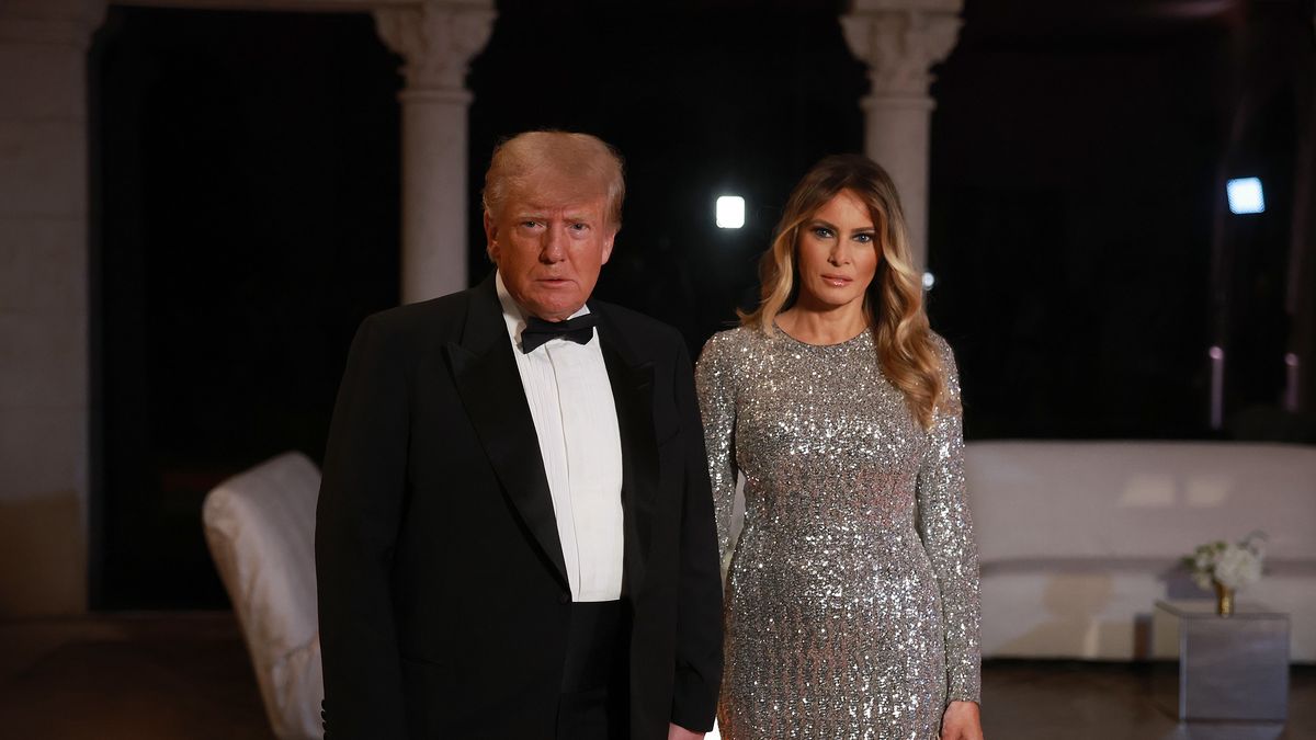 PALM BEACH, FLORIDA - DECEMBER 31: Former U.S. President Donald Trump and former first lady Melania Trump arrive for a New Years event at his Mar-a-Lago home on December 31, 2022 in Palm Beach, Florida. Trump continues to run for a second term as the President of the United States. (Photo by Joe Raedle/Getty Images)