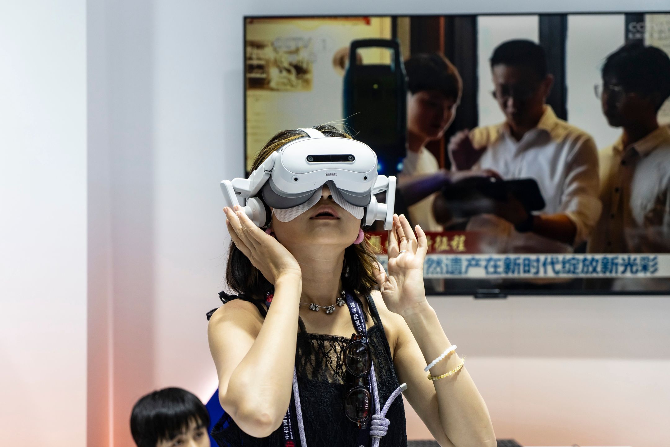 An attendee tries a virtual reality (VR) headset at the MWC Shanghai tech show in Shanghai, China, on Thursday, June 19, 2025. The show runs through June 20. Photographer: Qilai Shen/Bloomberg via Getty Images