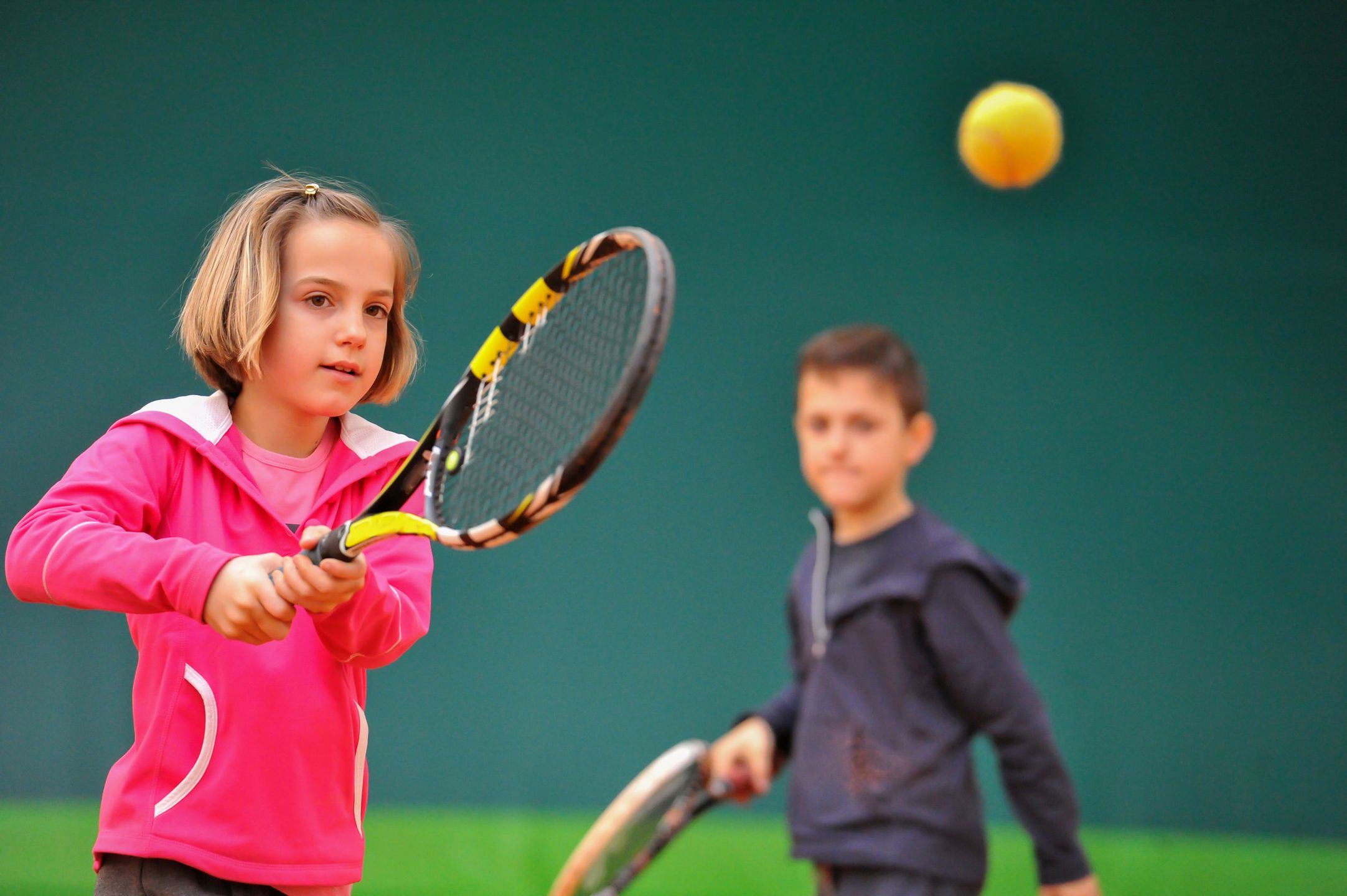 Children at school during a dribble of tennis 