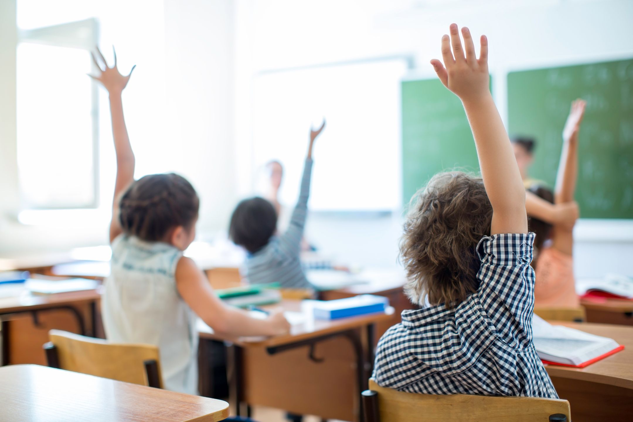 Children at a desk in classroom