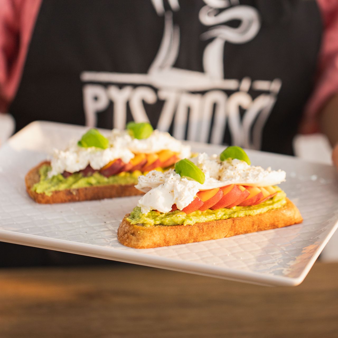 Toast with burrata, avocado and peach