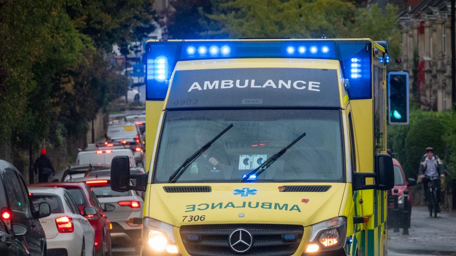 BATH, UNITED KINGDOM - OCTOBER 07: A ambulance on its way to a emergency with its lights and sirens on, pass vehicles as they queue in morning commuter traffic on the Wellsway, a major through route in the city, on October 7, 2024 in Bath, England. Two recent reports have concluded that air quality across Bath and North East Somerset is continuing to improve, with the average nitrogen dioxide (NO2) concentrations within the Bath Clean Air Zone (CAZ) - which was introduced in 2021 - are 32% lower. (Photo by Anna Barclay/Getty Images)