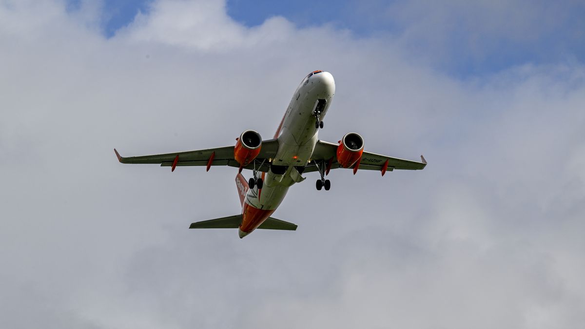 LISBON, PORTUGAL - DECEMBER 08: An EasyJet airplane takes off from Humberto Delgado International Airport as TAP Air Portugal cancels 360 flights on December 8 and 9 due to a strike called by the National Union of Aviation Flight Personnel (SNPVAC) on December 08, 2022 in Lisbon, Portugal. The Portuguese airliner TAP usually provides 300 flights a day. Strikes are expected in multiple destinations around Europe as inflation has affected company recovery plans and employee wages. TAP decided to cancel flights affecting some 50 thousand passengers, after having received the strike notice from the National Union of Aviation Flight Personnel (SNPVAC) for December 8 and 9, in order to end uncertainty for customers. TAP said in a November 28 statement that "To prevent Customers with flights booked for these dates from being further affected by the uncertainty over whether or not their flight, due to the strike, will take place, TAP has decided to cancel 360 flights scheduled for the two days of the strike. This decision will be very costly for TAP, but it is the right decision to protect our passengers." (Photo by Horacio Villalobos#Corbis/Getty Images)