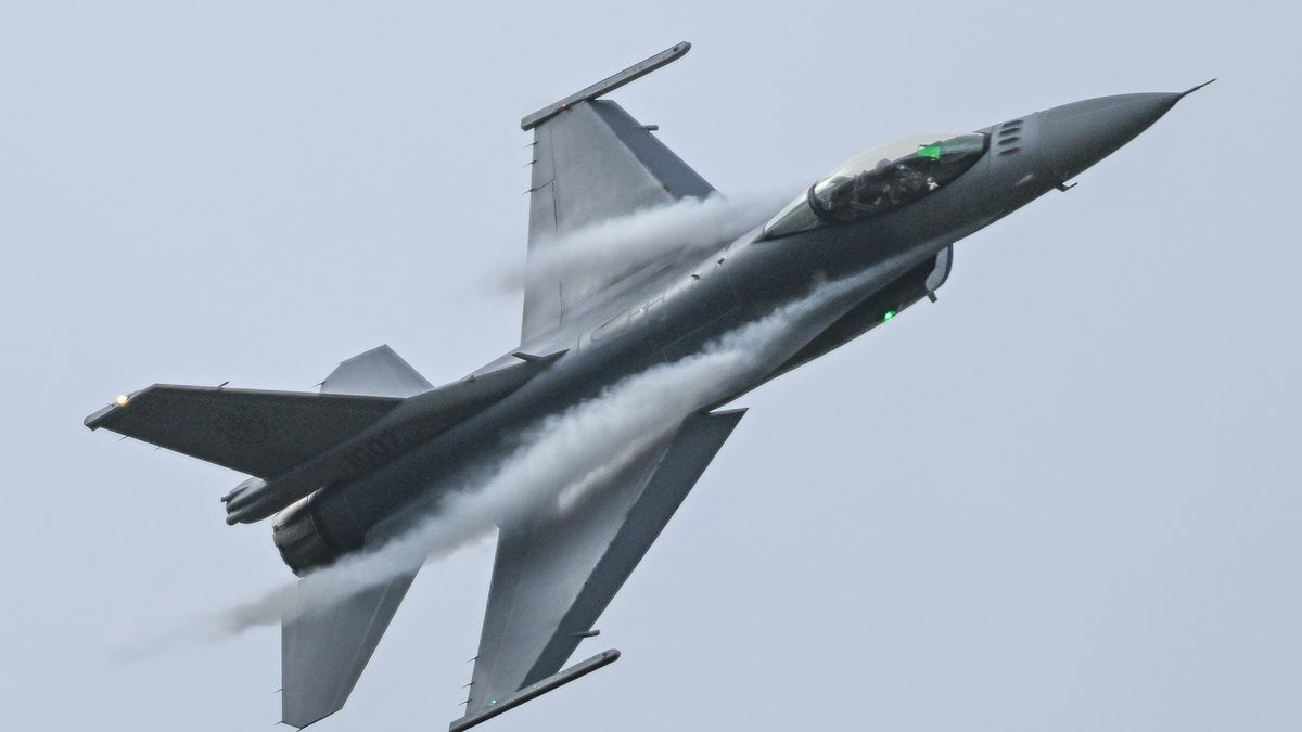 MOSNOV, CZECH REPUBLIC - SEPTEMBER 20: Aerodynamic condensation vapor trails stream from the wing leading edges of a Slovak F-16 Fighting Falcon jet during a high-G turn on the final day of NATO Days at Leos Janacek Airport in Mosnov, Czech Republic, on September 20, 2026. (Photo by Artur Widak/NurPhoto via Getty Images)
