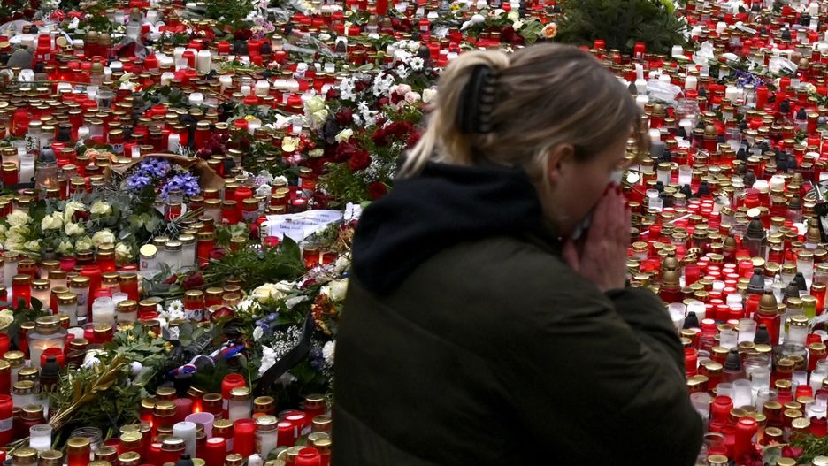 Temporary
A young woman reacts by the floral tributes and candles left outside the headquarters of Charles University in downtown Prague, Czech Republic, Saturday, Dec. 23, 2023. A lone gunman opened fire at a university on Thursday, killing over 12 people and injuring dozens. (AP Photo/Denes Erdos)
Denes Erdos