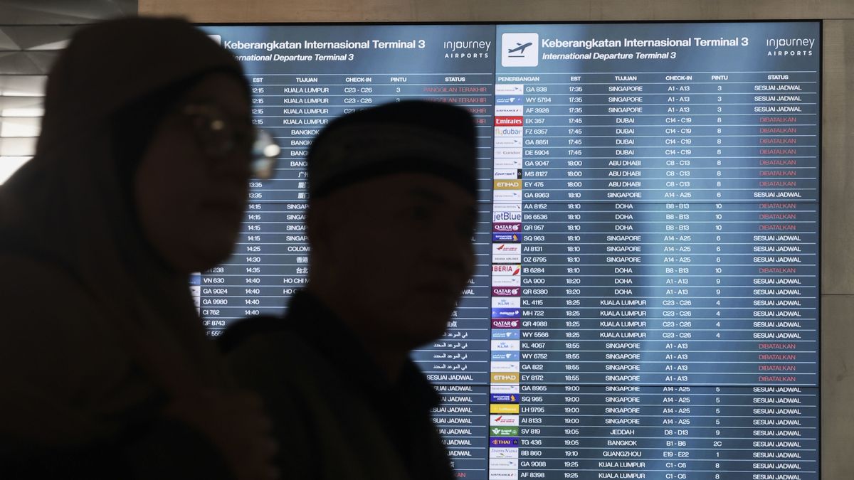 A departure board displays flight cancellations at Soekarno-Hatta International Airport after several flights to Dubai and Doha are canceled following strikes on Iran launched by the United States and Israel and Tehran's retaliatory action, in Tangerang, Banten Province, Indonesia, on March 2, 2026. (Photo by Agoes Rudianto/NurPhoto via Getty Images)