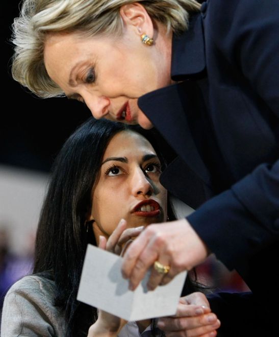 LOS ANGELES, CA - FEBRUARY 02:  Democratic presidential hopeful US Sen. Hillary Clinton (D-NY) talks with a campaign staffer as she waits to speak at a rally at California State Los Angeles February 2, 2008 in Los Angeles, California. With less than one week to go until Super Tuesday, Clinton is campaigning through California.  (Photo by Justin Sullivan/Getty Images) 