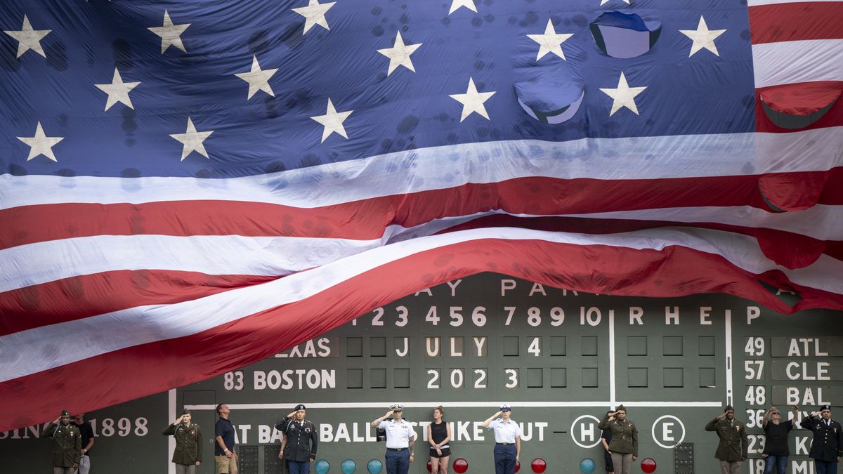 Texas Rangers v Boston Red SoxBOSTON, MA - JULY 4: An American flag is draped over the Green Monster for Independence Day before a game between the Texas Rangers and the Boston Red Sox on July 4, 2023 at Fenway Park in Boston, Massachusetts. (Photo by Maddie Malhotra/Boston Red Sox/Getty Images)Maddie Malhotra/Boston Red Soxbaseball, american league, national league