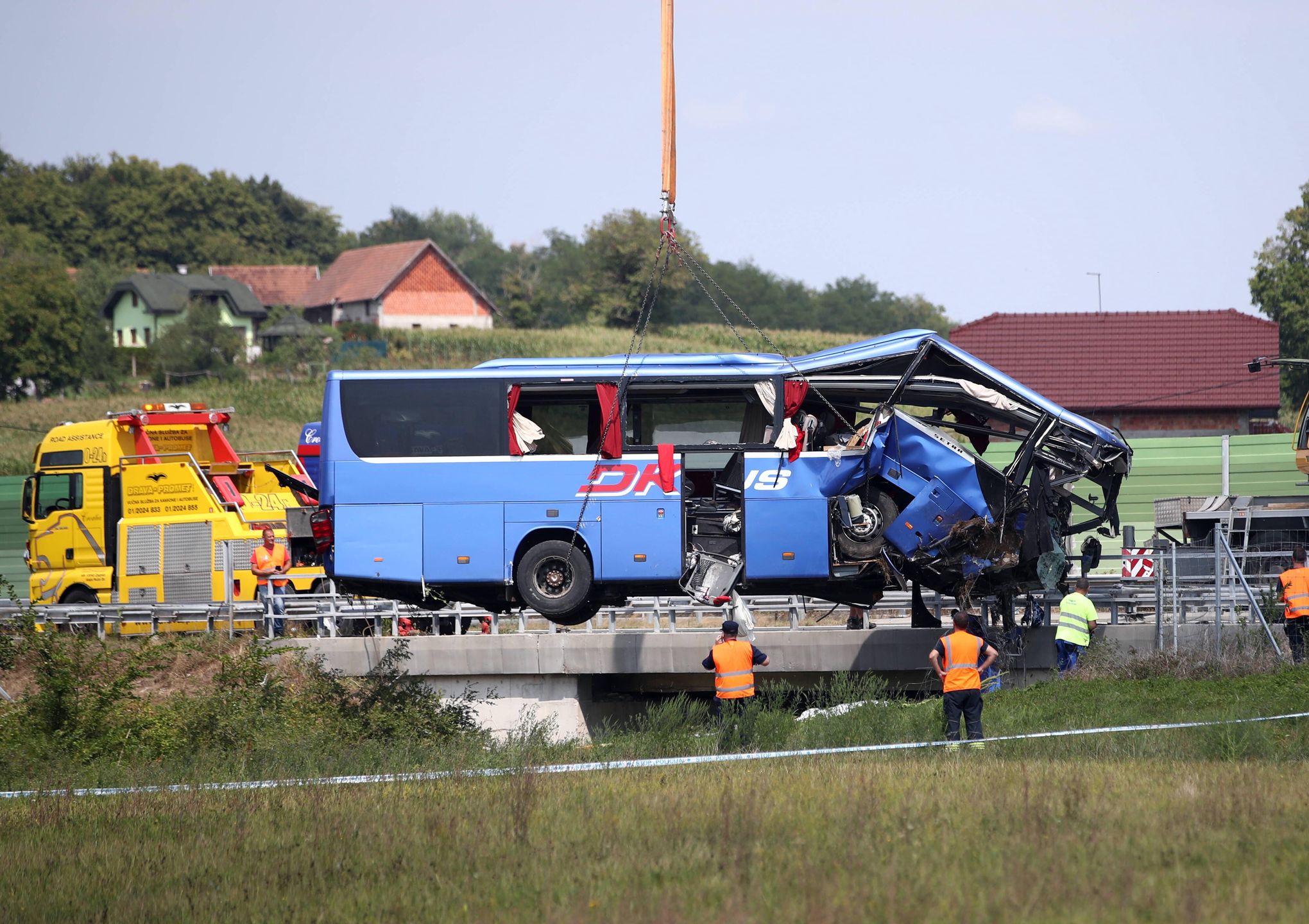 Polish bus crash in Croatia
A crane works on removing the bus with Polish licence plates that slipped off a road, from the scene near Varazdin, northwestern Croatia, August 6, 2022. At least 12 people died and 31 injured after a Polish bus filled with religious pilgrims skidded off a highway in northern Croatia early on Saturday morning. 18 people among the 31 hurt have suffered serious injuries after the bus crashed off the A4 highway in Podvorec, about 30 miles (50km) north of capital Zagreb. Photo: Zeljko Lukunic/PIXSELL 
Dostawca: PAP/PIXSELL
Zeljko Lukunic/PIXSELL
accident, bus, emergency, police