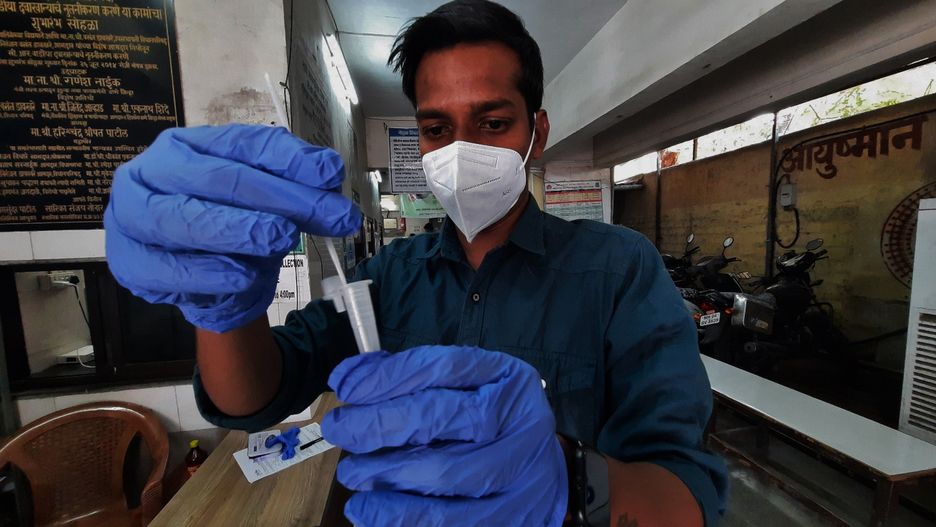 MUMBAI, INDIA  APRIL 1: A health worker collects swab samples of citizens for Covid-19 test as cases have increased in the city, at TMC's C.R. Wadia Hospital on April 1, 2023 in Mumbai, India. India saw a sharp jump in the number of active Covid-19 cases as it logged 3,824 cases in the past 24 hours as per the data shared by the Health Ministry on Sunday. (Photo by Praful Gangurde/Hindustan Times via Getty Images)
