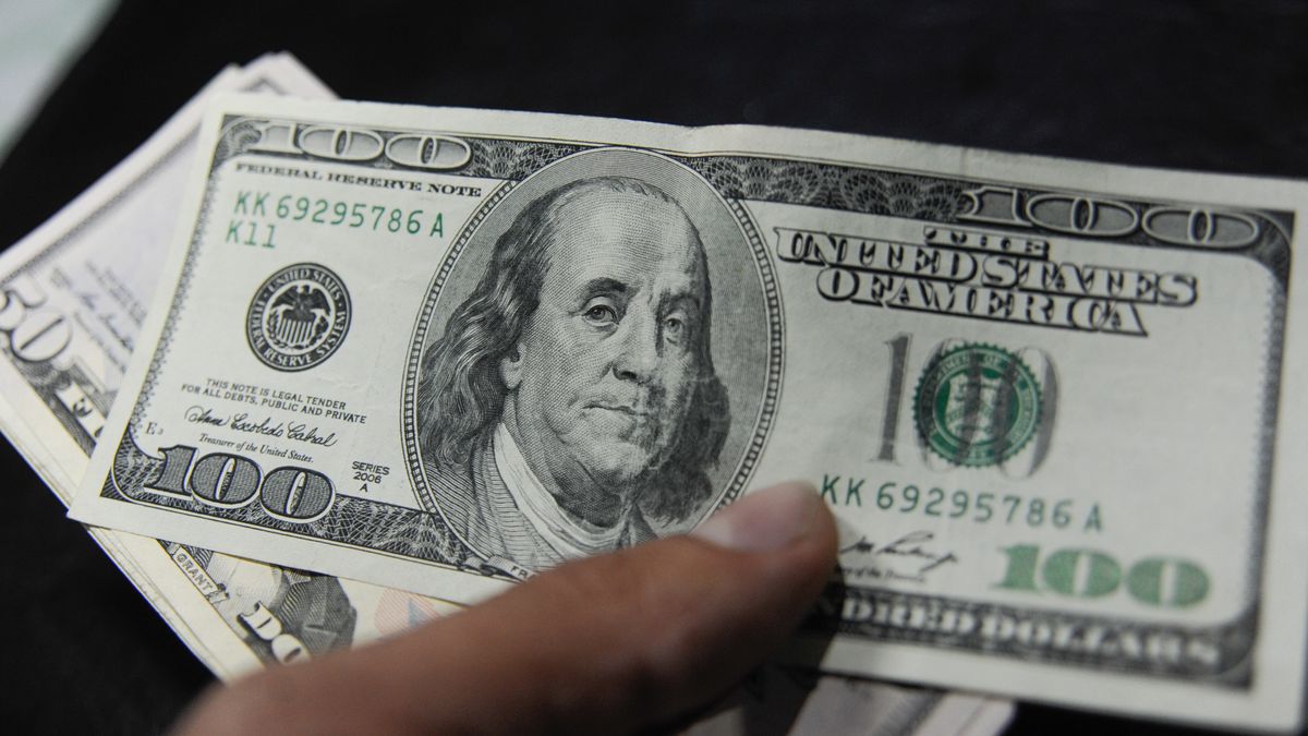 This photo illustration shows the Argentine peso bills in relation to the US dollar in Buenos Aires, Argentina, on September 11, 2019. (Photo illustration by Gabriel Sotelo/NurPhoto via Getty Images)
