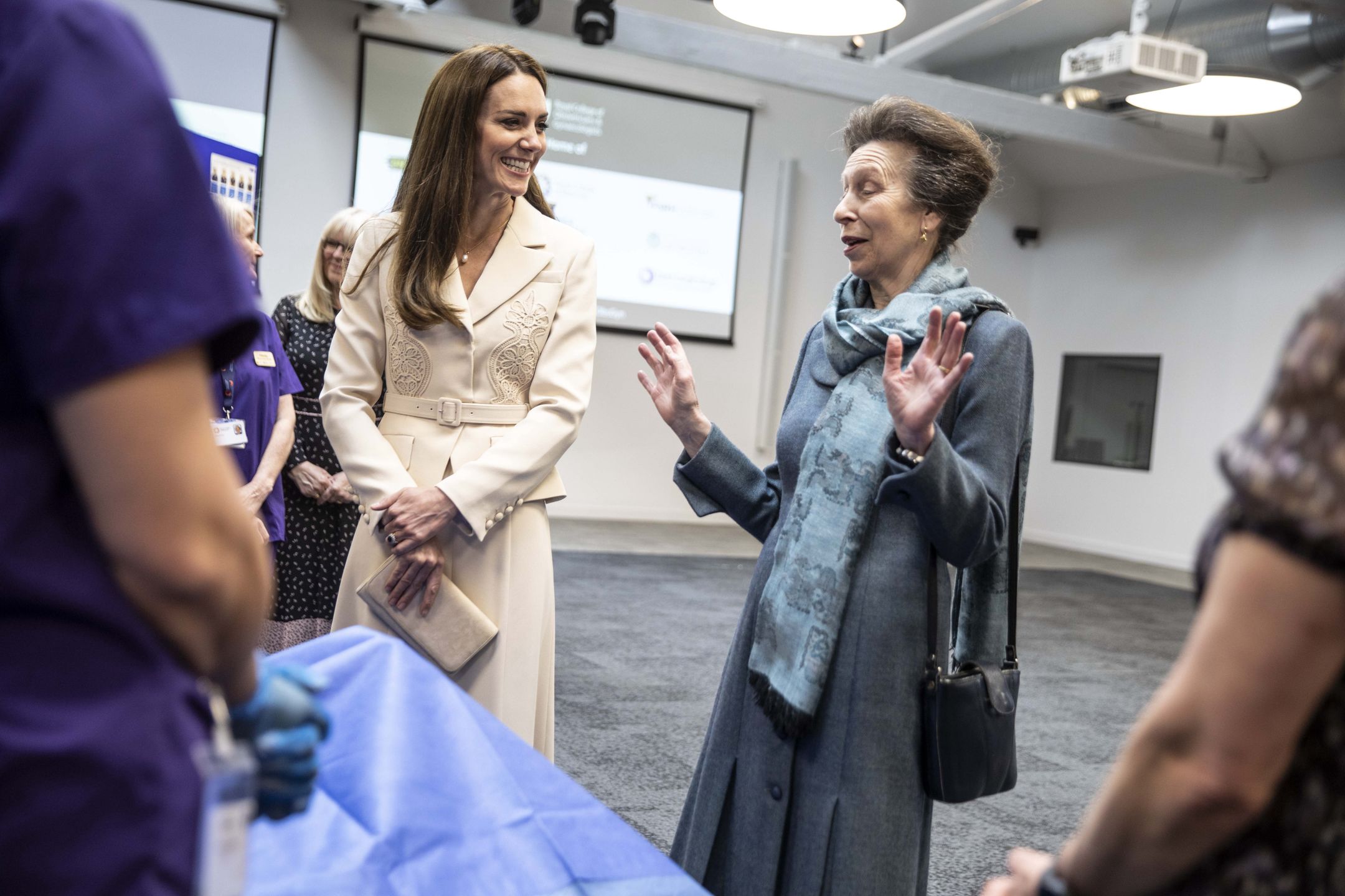 The Princess Royal And The Duchess Of Cambridge Visit Maternal Healthcare OrganisationsLONDON, ENGLAND - APRIL 27: Princess Anne, The Princess Royal, Patron of the Royal College of Midwives (RCM), and Catherine, Duchess of Cambridge, Patron of the Royal College of Obstetricians and Gynaecologists (RCOG), watch a demonstration of a mock emergency caesarian operation by Dr Katie Cornthwaite using a dummy during a visit the RCM and RCOGs headquarters on April 27, 2022 in London, England. Home to a collection of womens healthcare organisations which are dedicated to improving and advocating for womens healthcare, the hub has been designed by the RCOG to foster collaboration across the sector. They heard about the ways in which the RCM and the RCOG are working together to improve maternal health care, ensuring women are receiving the safest and best care possible at one of the most significant times in their lives. (Photo by Richard Pohle - WPA Pool/Getty Images)WPA Pool